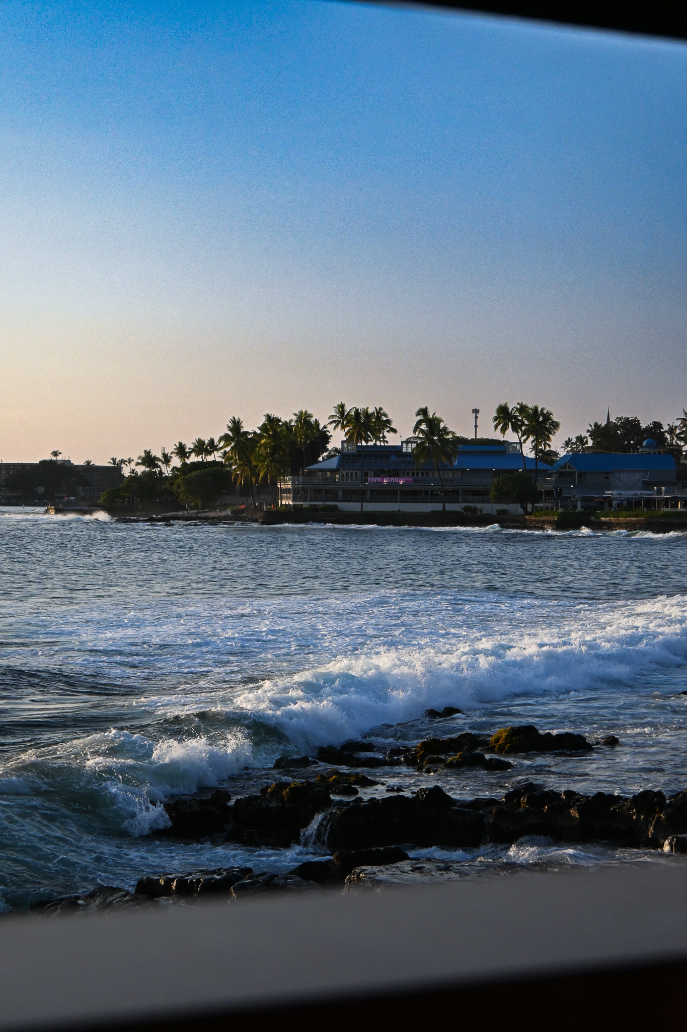 Waves on the Kona shoreline below the restaurant